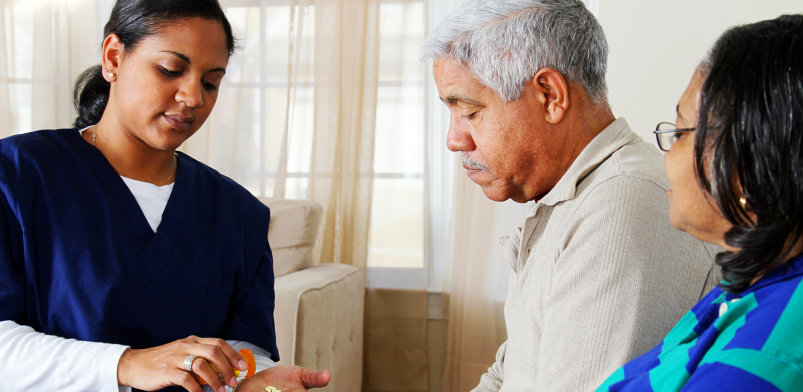 Home health care worker and an elderly couple