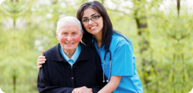 An elderly woman and caregiver